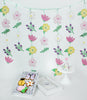 flower backdrop with floral party hats and cookies